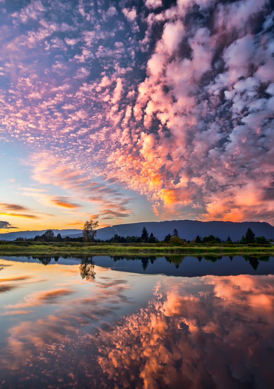 symmetrical photography of clouds covered blue sky