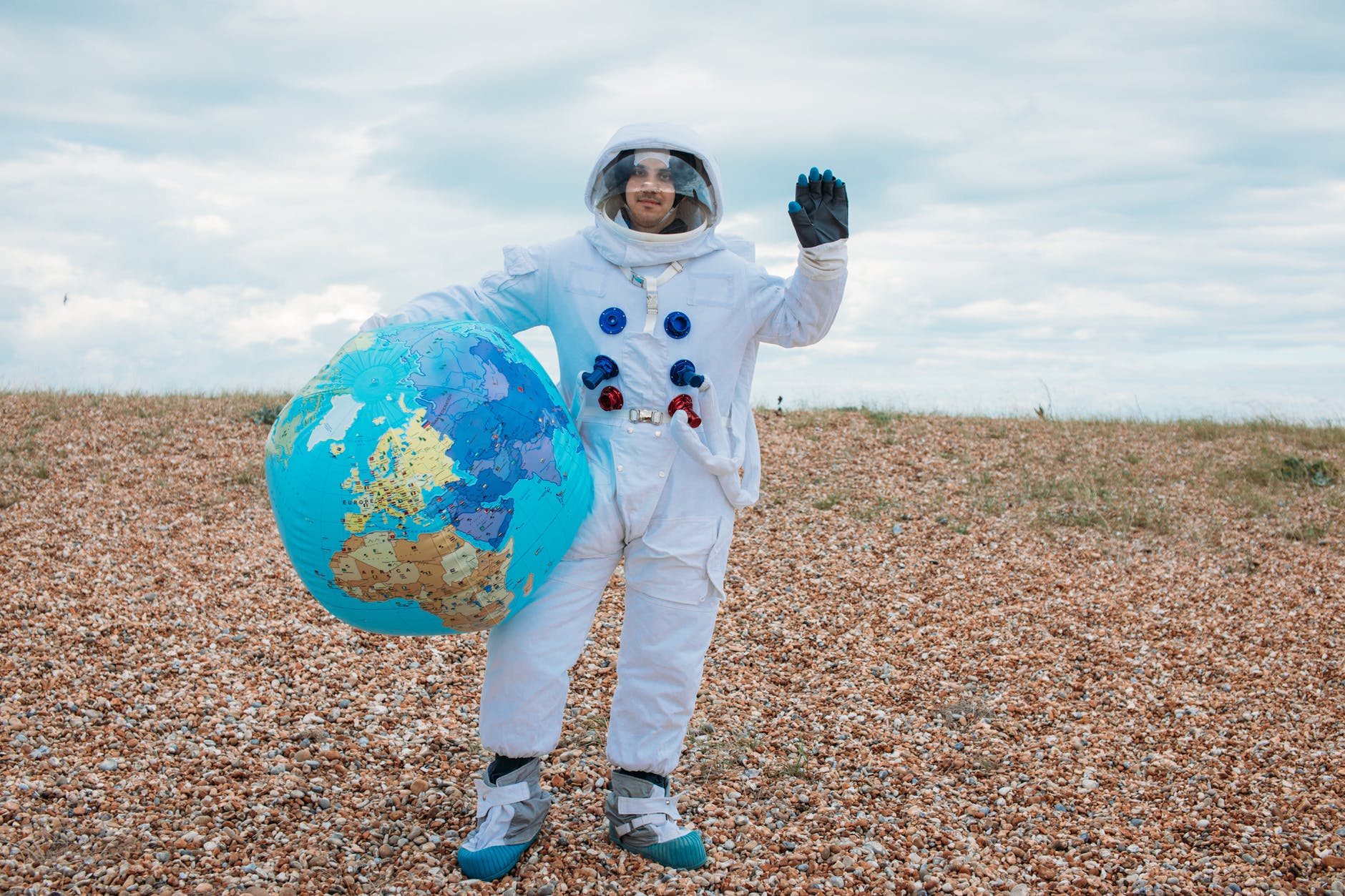 astronaut holding the earth