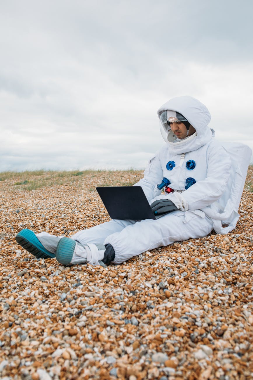 astronaut using a laptop