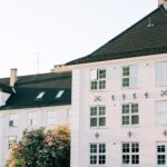 residential old white multistory building in suburb