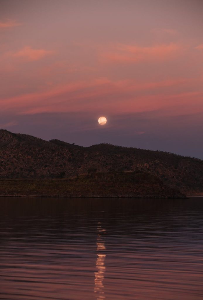 calm sea and mountains at sunset time