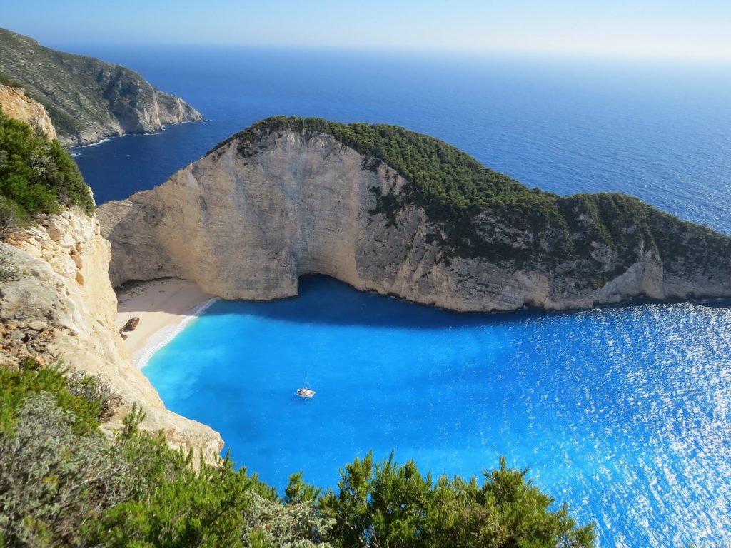 blue sea under clear blue sky