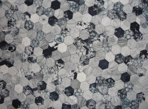 gray and black hive printed textile