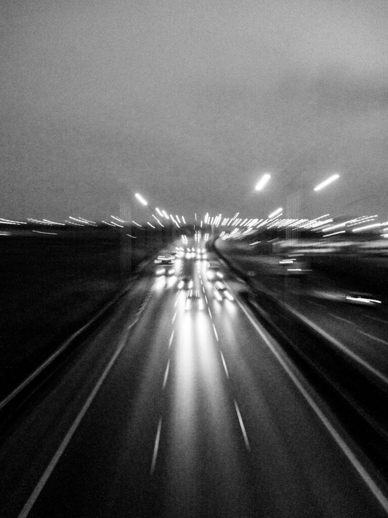 dynamic black and white highway lights at night